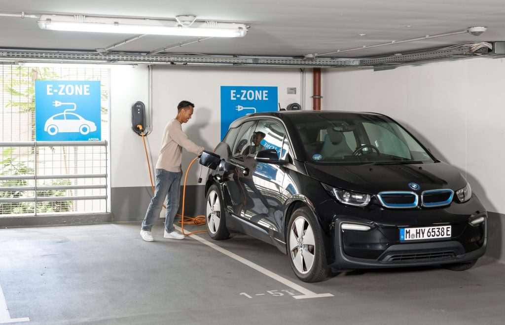 Charging a BMW i3 at an APCOA parking garage.
